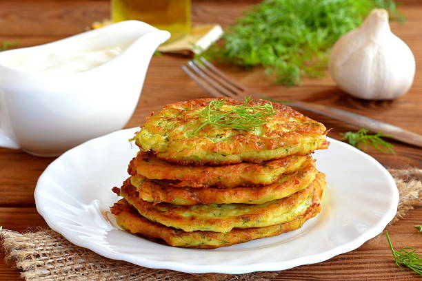 istock Fried golden pancakes with zucchini and dill 614146676