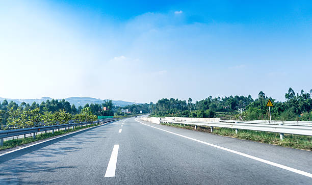 istock Car driving on the highway sky,road and sky 614147840