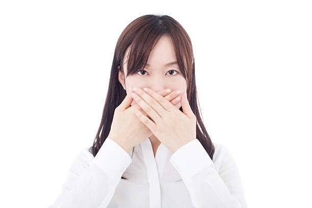 istock Woman with hands over mouth 614148332