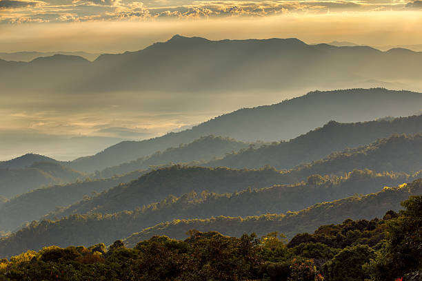 istock Layer of mountains and mist at sunset time 614148960