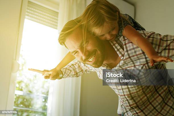 Young Dad With Cute Daughter At Home Stock Photo - Download Image Now - Father, Daughter, Window