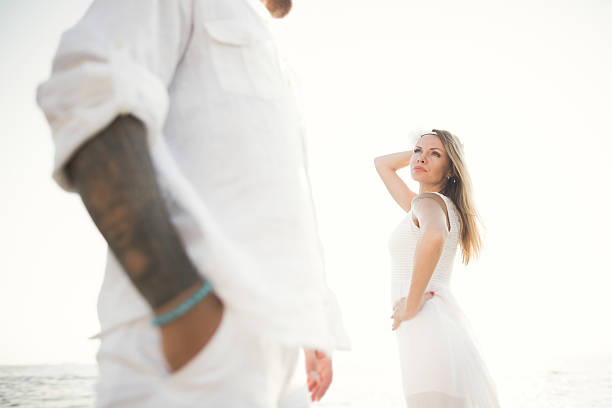 istock happy just married young wedding couple celebrating and have fun 614149396