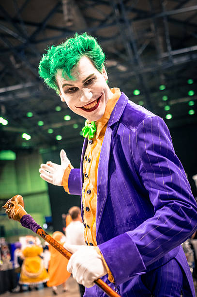 Joker Cosplay Sheffield, UK - June 11, 2016: Host & entertainer 'Jimcredible' dressed as the Joker character from 'Batman' at the Yorkshire Cosplay Convention at Sheffield Arena cosplay event stock pictures, royalty-free photos & images