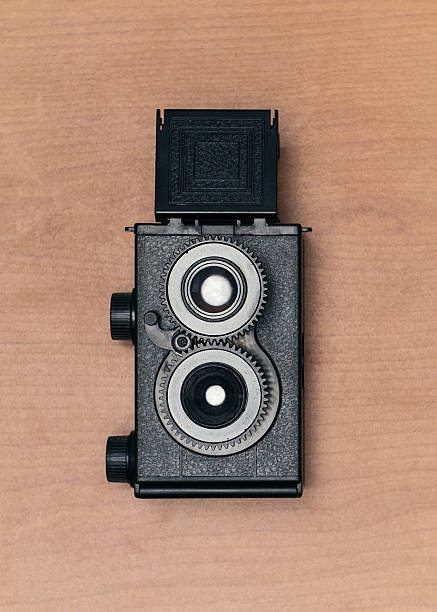 Old vintage camera on wooden background