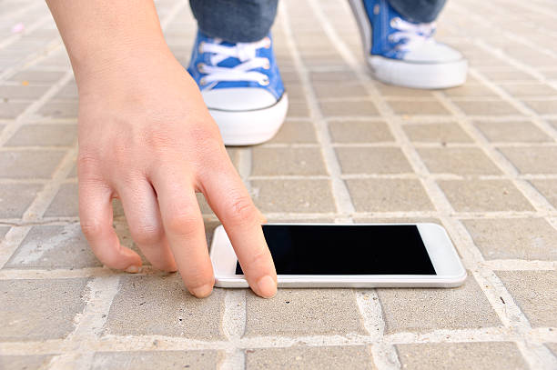 istock finding a modern smartphone on the street 614151300