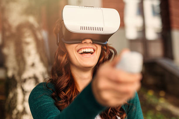 Virtual Reality Simulator Man using a virtual reality simulator. head mounted display stock pictures, royalty-free photos & images