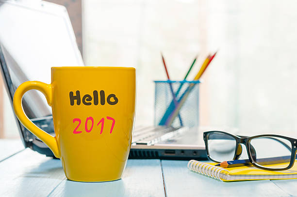 istock Hello 2017 on morning coffee cup. New year concept at 614205204