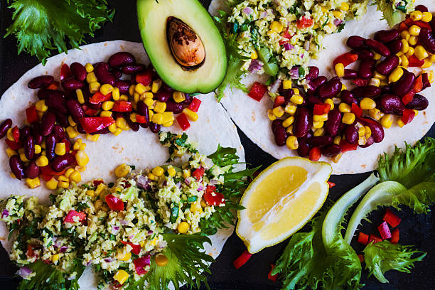 Vegetarian tacos with guacamole, corn, black beans