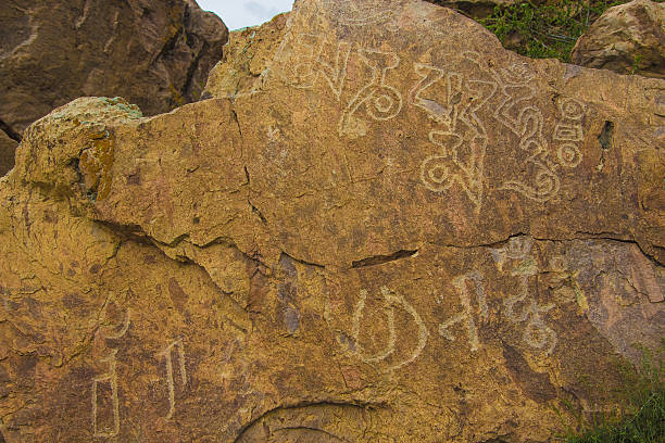 istock Petroglyphs on the stone in Tamgaly, Kazakhstan 614208090