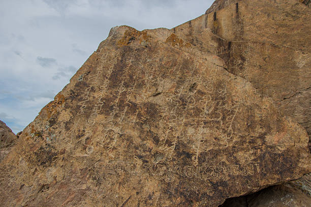 istock Petroglyphs on the stone in Tamgaly, Kazakhstan 614208182
