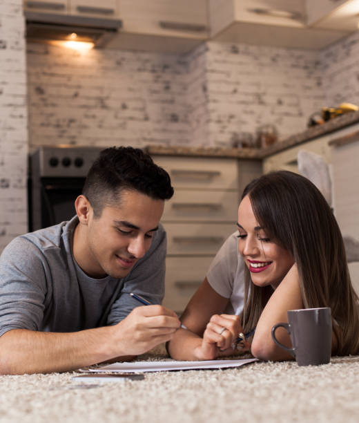 istock Happy young couple planning finances 614211532