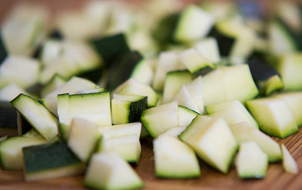 istock close up on zucchini pieces on wood 614214376