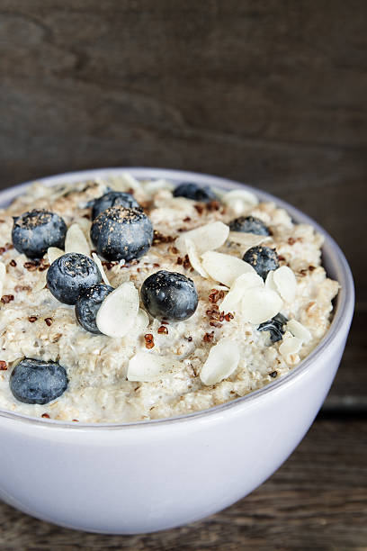 Porridge with quinoa and blueberries stock photo