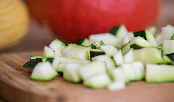 istock close up on zucchini pieces on wood 614214452