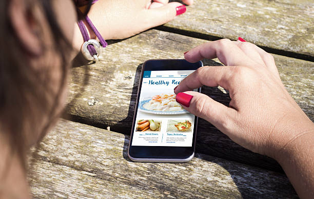 istock woman checking phone on the table 614214616