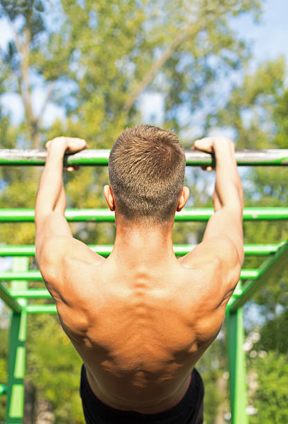 istock Muscular Young Man During His Workout in the Park 614214918