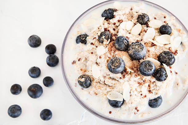 Healthy porridge with quinoa and blueberries stock photo
