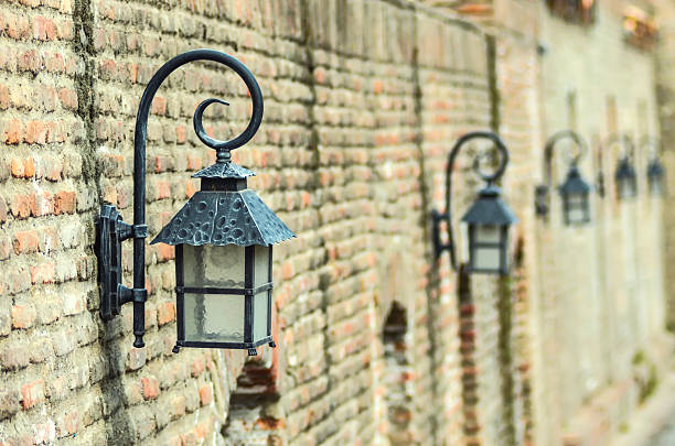 istock lanterns on the background of an old brick wall 614215606