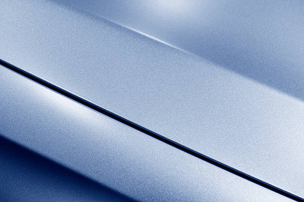 Blue sedan bodywork Surface of blue sport sedan car metal hood, part of vehicle bodywork, steel gradient line pattern, selective focus  bodywork stock pictures, royalty-free photos & images