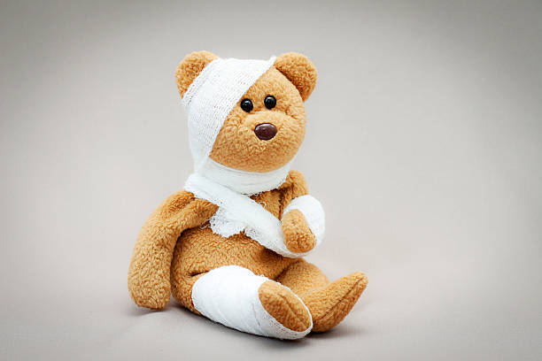 Teddy bear with bandage stock photo
