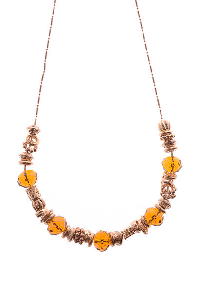 istock necklace with amber beads on white background 614217162