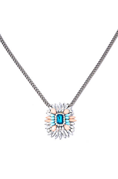 istock pendant with flower and blue gem  on a white background 614219132