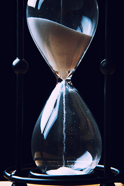 istock Hourglass on dark background. Close-up 614219622