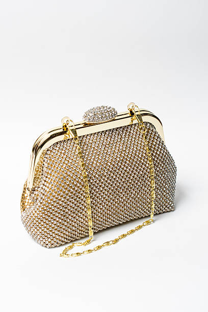 istock gold clutch with diamonds on a white background 614219656
