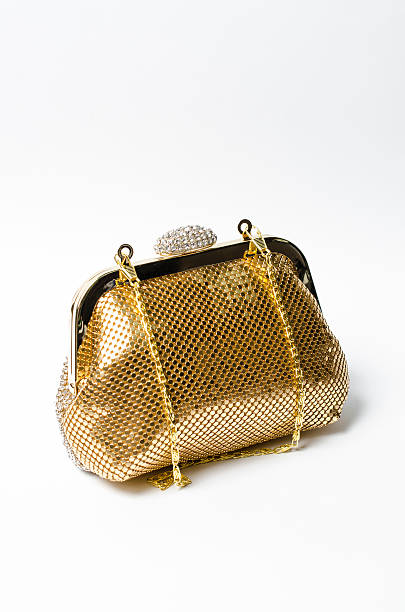istock gold clutch with diamonds on a white background 614219728