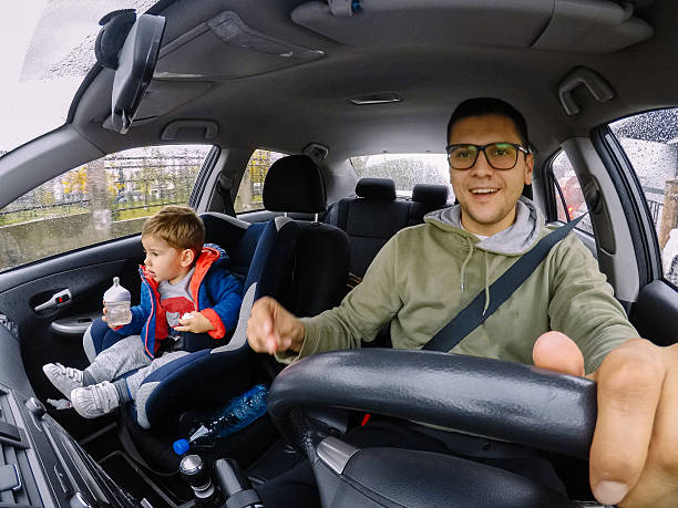 istock Father and son in the car 614220254