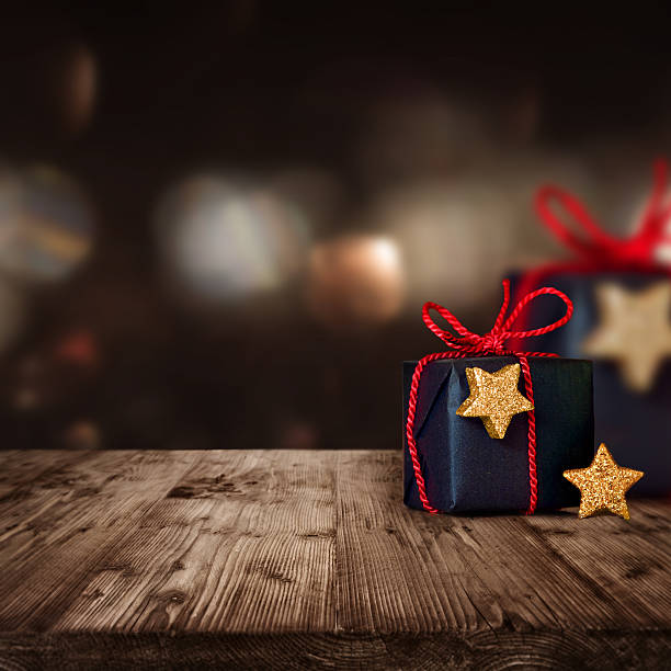 istock Christmas parcels on a wooden Table 614220726