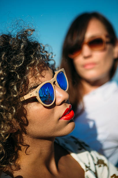 istock Mixed race adorable woman posing in sunglasses 614221232