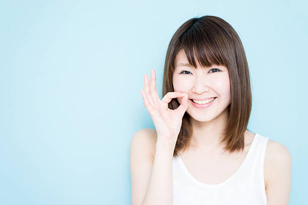 istock Woman making ok sign 614221896
