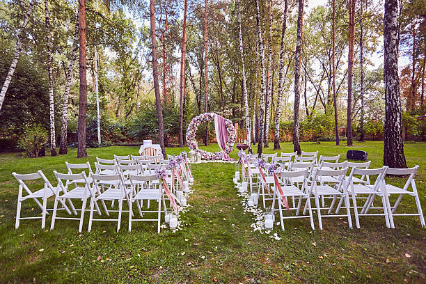 istock Beautiful wedding set up.  ceremony place in the forest 614223110