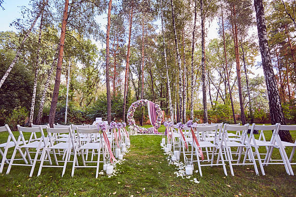 istock Beautiful wedding set up.  ceremony place in the forest 614223204