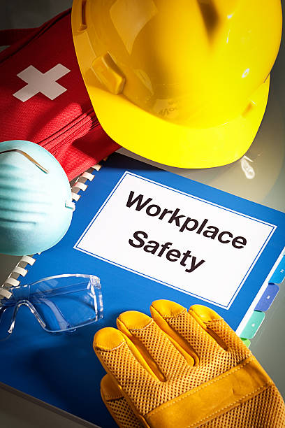 istock Workplace Safety Handbook Manual and Equipment Vertical Close-up 614223580