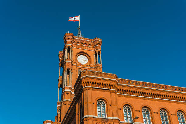 istock berlin townhall with flag on the roof 614225318