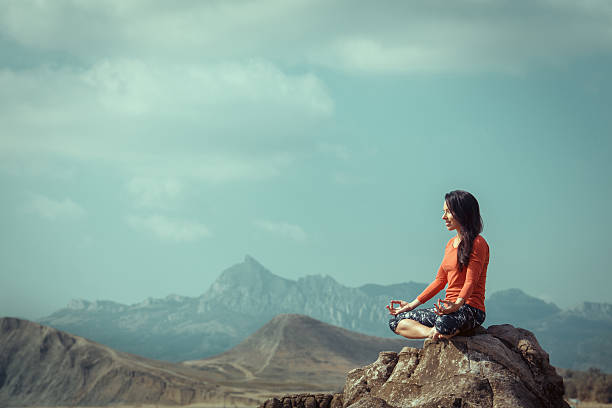 istock Caucasian woman practicing yoga at seashore 614226960
