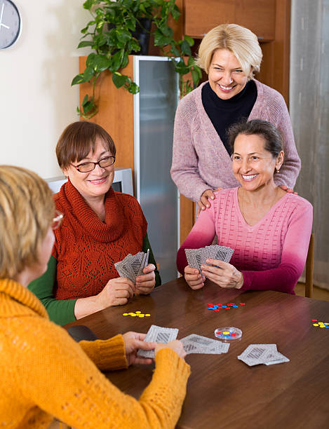 istock Female pensioners playing cards 614227030