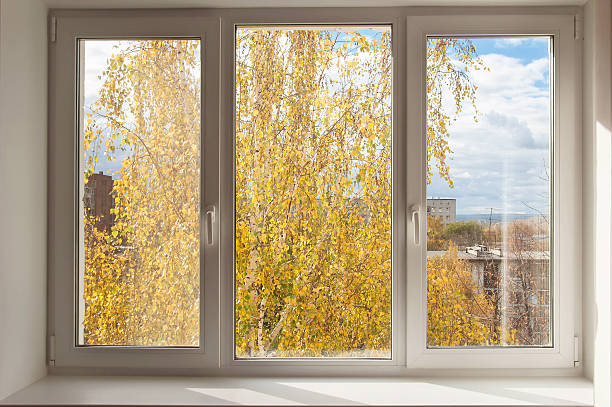 New white window overlook autumn yellow trees