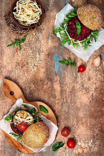 Vegan grilled eggplant, arugula, sprouts, pesto, beet, quinoa burgers.