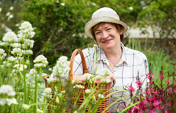 istock mature gardener woman basket 614228732