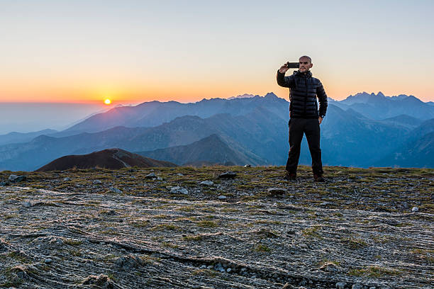 istock Selfie with mountains at sunrise. 614229124