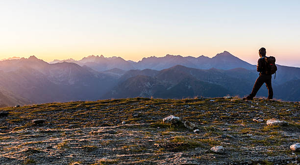 istock Tourist from backpacker admiring the sunrise. 614229472