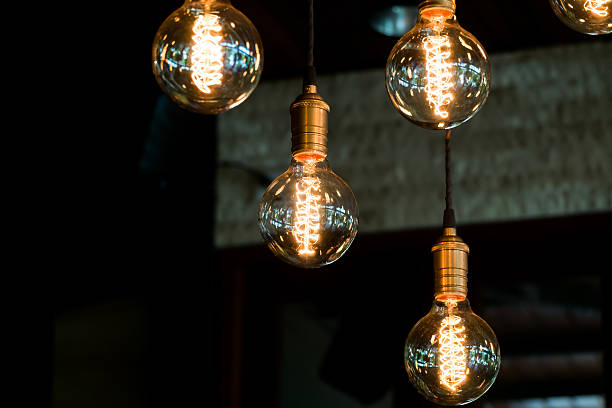 istock Burning an incandescent lamp with a large decorative spiral 614229508