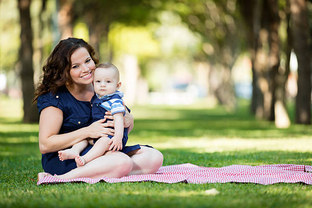 Baby and mother in park.