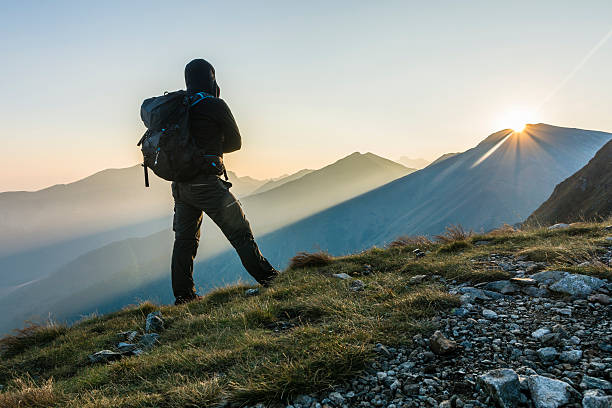 istock Hiker with backpack in the morning in the mountains. 614231026