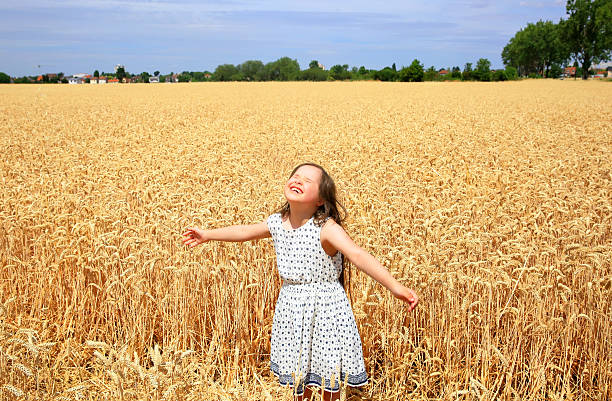 istock Young girl have fun in the wheat field 614231844