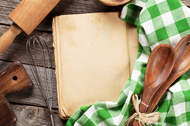 istock Blank vintage recipe cooking book and utensils 614233270