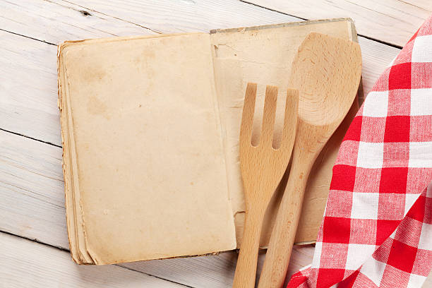 istock Blank vintage recipe cooking book and utensils 614233372